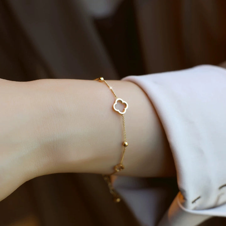 S925 sterling silver 14K gold-plated hollow four-leaf clover bracelet