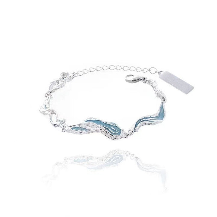 Asymmetrical light blue resin bracelet
