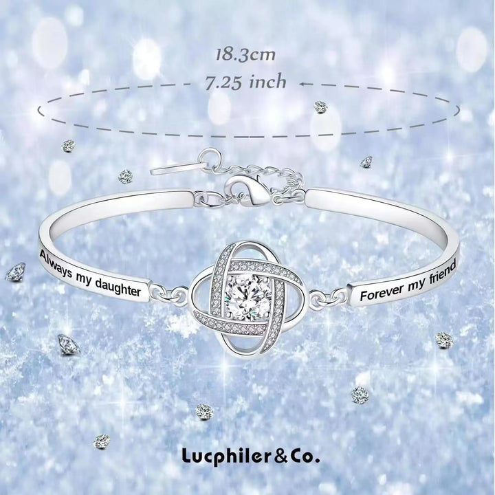 Four-leaf clover charm bracelet with floral detail