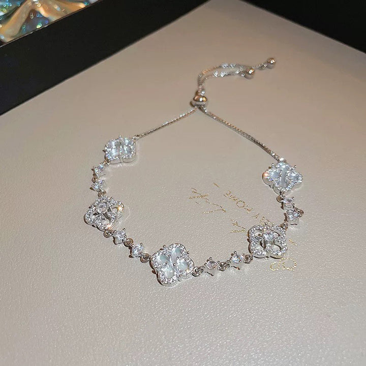 Zircon shell four-leaf flower bracelet, gold-plated copper